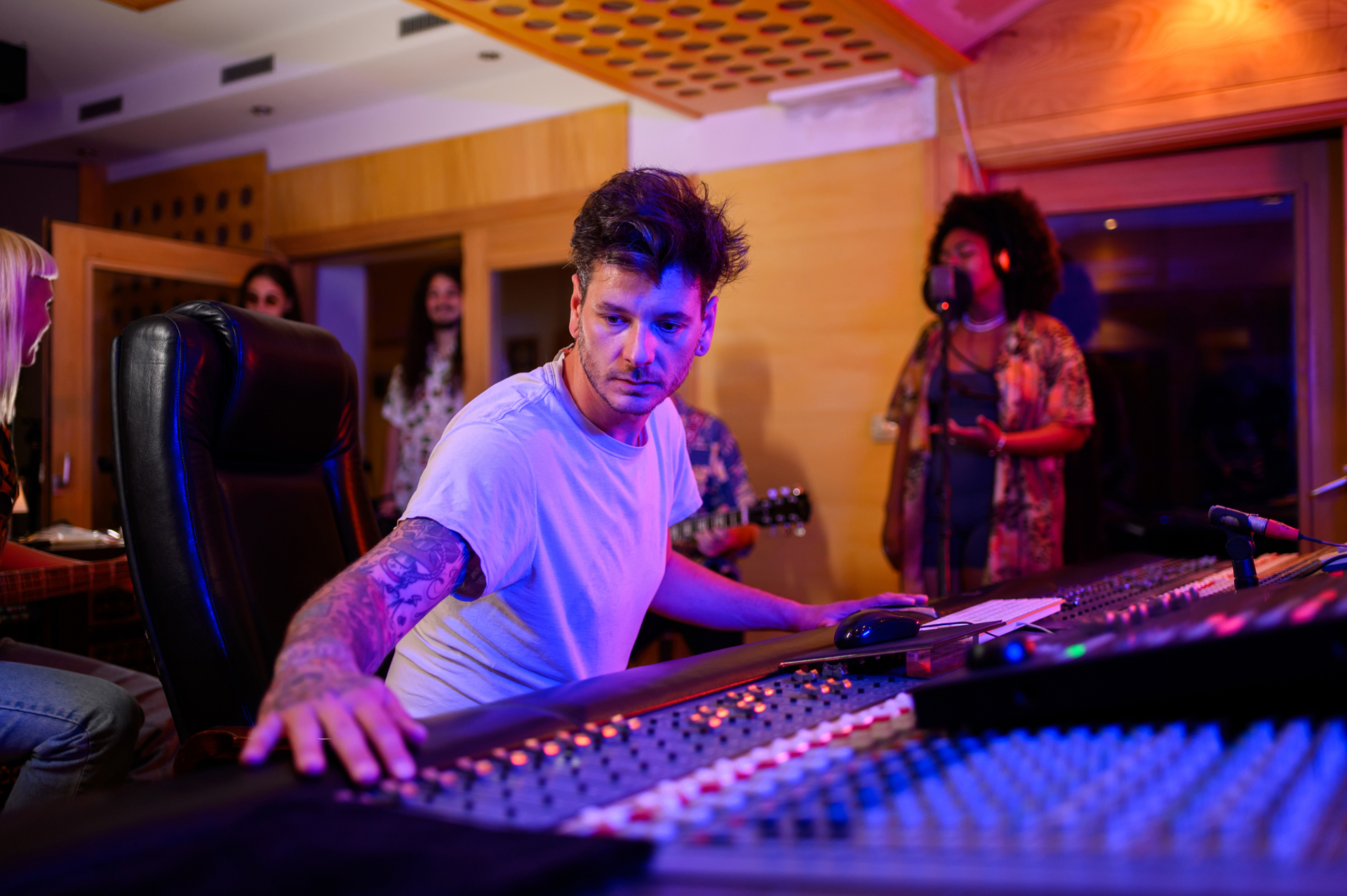 Music producer at mixing console